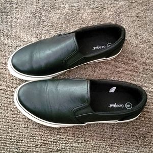 Black pleather slip ons